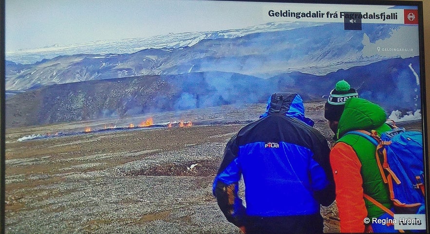 People blocking the view of the volcano on the live camera