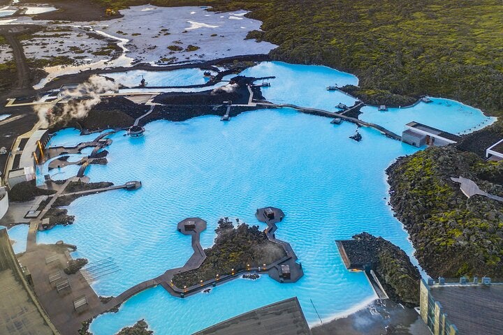The Blue Lagoon of Iceland offers a unique chance to relax in warm geothermal waters surrounded by stunning lava fields.