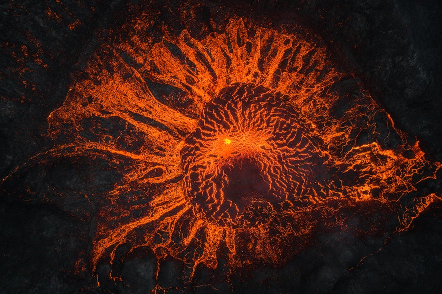 The lava of Fagardalsfjall glows in the winter darkness.