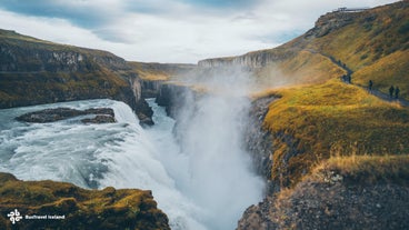 Capture the breathtaking beauty of Gullfoss, where water meets canyon in a spectacular display.