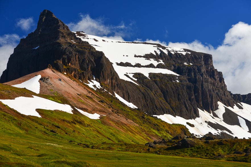 Imposing Dyrfjöll mountain towers above Stórurð valley, East Fjords, Iceland