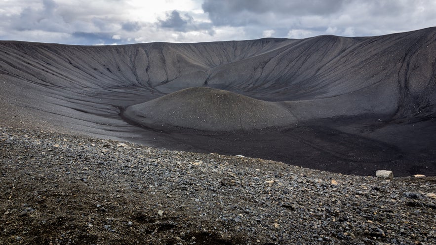 Hverfjall explosion volcano cone, landscape of tephra cone (tuff ring volcano) in northern Iceland with black volcanic rocks. Hverfjall explosion volcano cone, landscape of tephra cone (tuff ring volcano) in northern Iceland with black volcanic rocks.