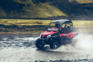 A two-ride buggy crossing a river in Thorsmork valley.