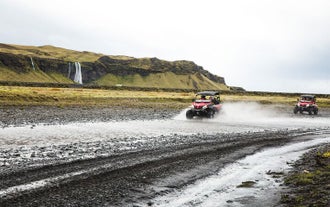 A buggy vehicle traversing a beautiful landscape in South Iceland.