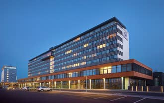 Hilton Reykjavik Nordica's hotel building at night.