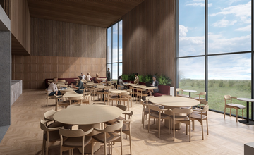 호텔 로아(Hotel Loa)의 세련된 라운지. 나무 테이블, 높은 창, 따뜻하고 현대적인 분위기에서 식사하거나 일하는 투숙객들이 있습니다.