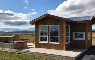 Blue View Cabin with deck overlooking open fields.