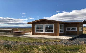 Blue View Cabin with deck overlooking open fields.