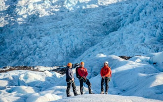 Three people on a glacier hiking tour in Iceland.