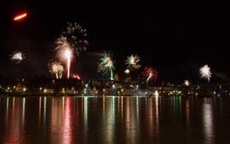 Fireworks bursting over Reykjavik from sea.