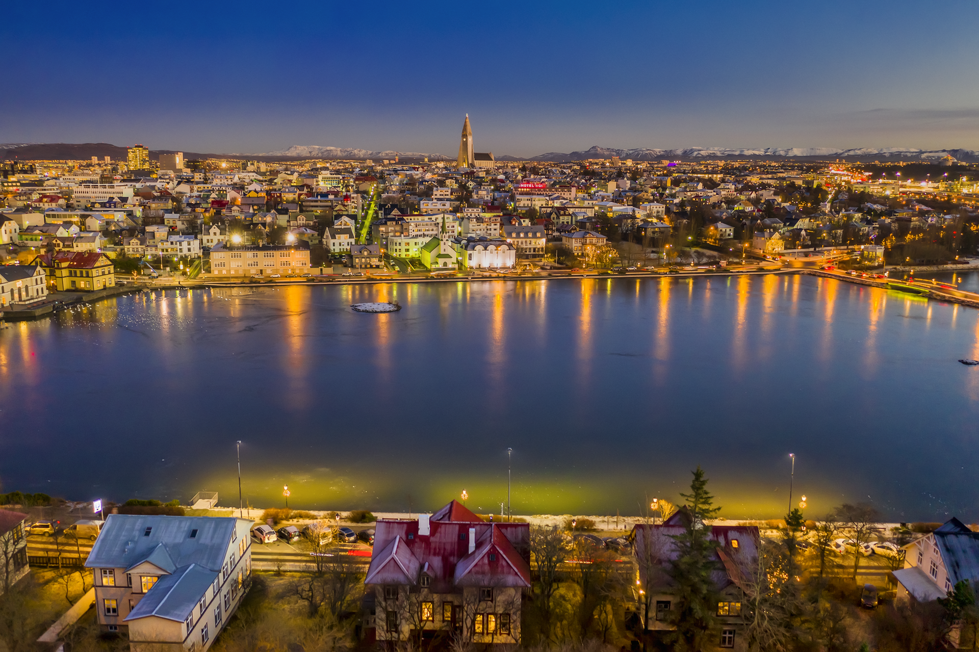 Reykjavik's Tjornin Pond surrounded by charming houses.