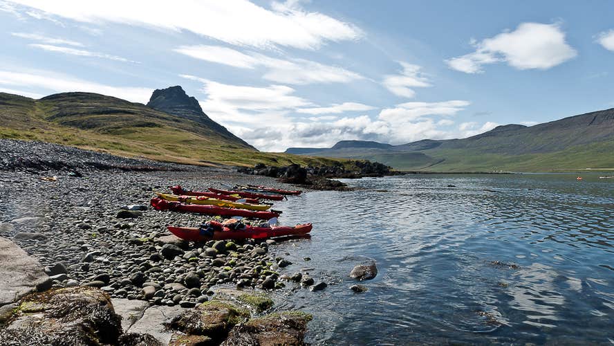 Kayakers pull up on the shores of the Westfjords.