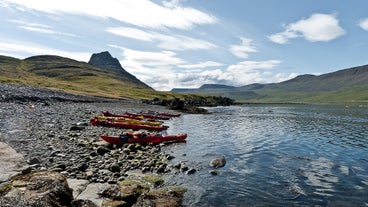 Kayakers pull up on the shores of the Westfjords.