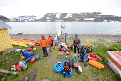 A group of kayakers with their gear in Hornstrandir.