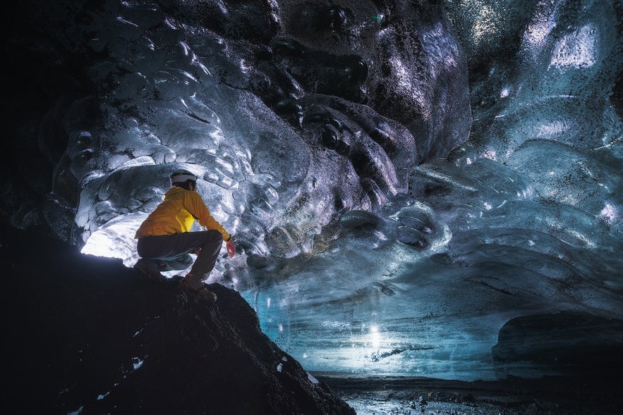 An image of a visitor exploring the Katla ice cave. 