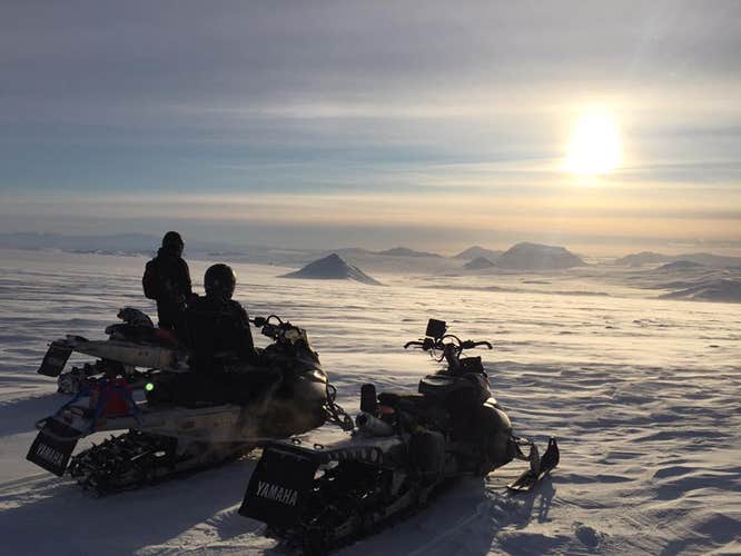 Snowmobilers scale the slopes of Langjokull.