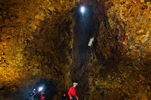 People exploring the magma chamber of Thrihnukagigur volcano during a guided tour in Iceland.