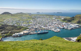 Panoramic view of Heimaey harbor and town in the Westman Islands.