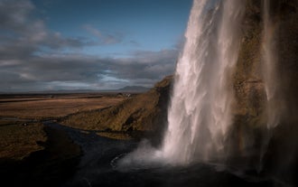 See the beautiful cascading waters of Seljalandsfoss in the land of fire and ice.