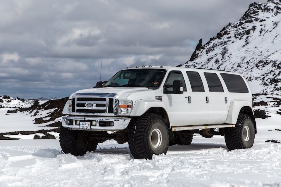 A super jeep pulls up onto the snows of Iceland's Highlands region.