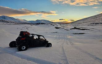 A buggy vehicle in Iceland traversing a snowy landscape near Reykjavik.