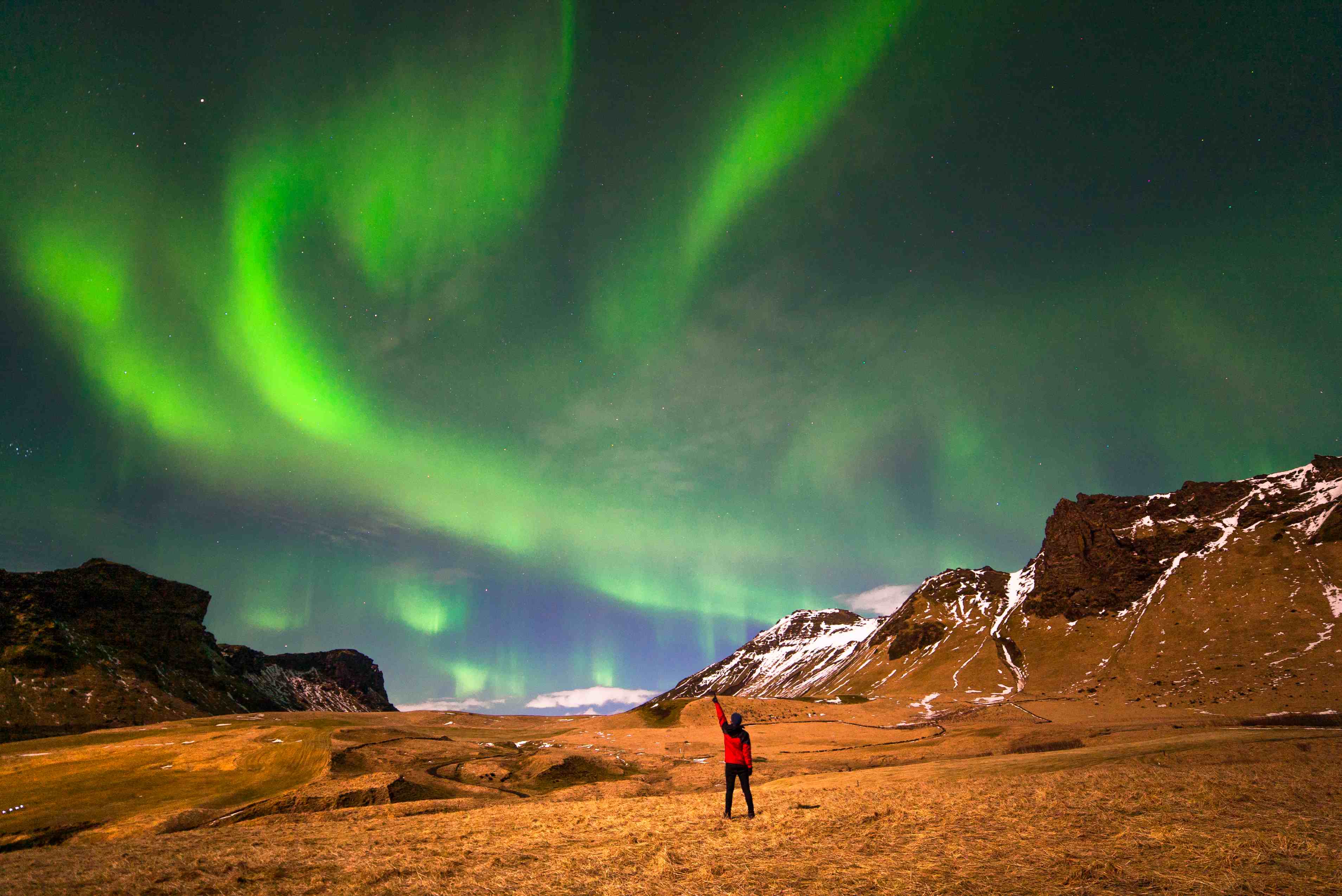 A swirl of aurora welcomes buggy adventurers in Iceland.