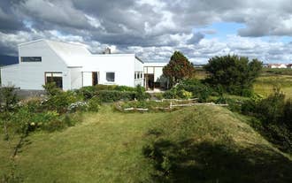Eyvindarholt Guesthouse on a sunny day.