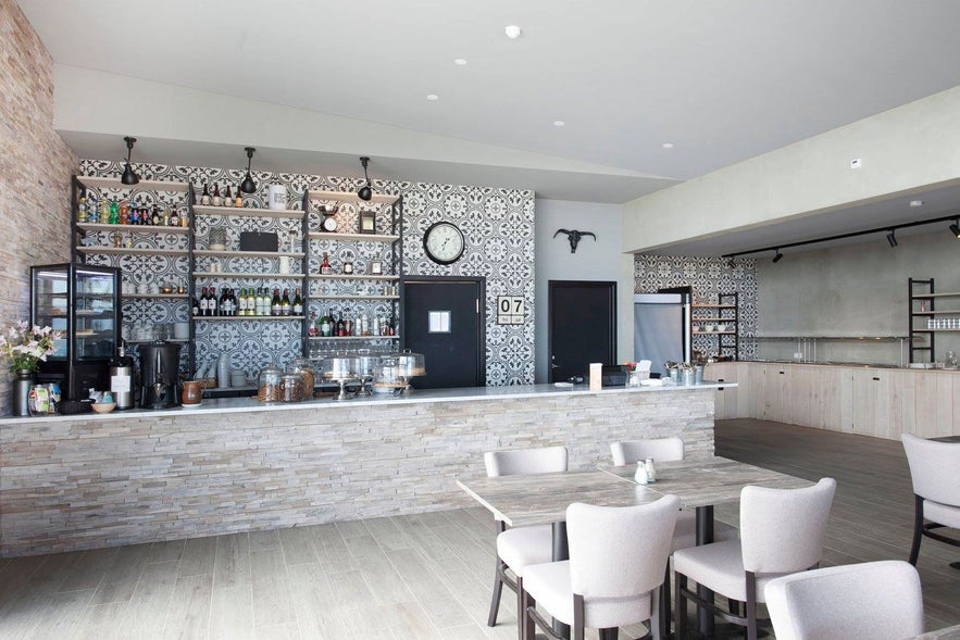 Snjófell restaurant's interior combines contemporary design with cozy Icelandic charm. Snjófell restaurant's interior combines contemporary design with cozy Icelandic charm.