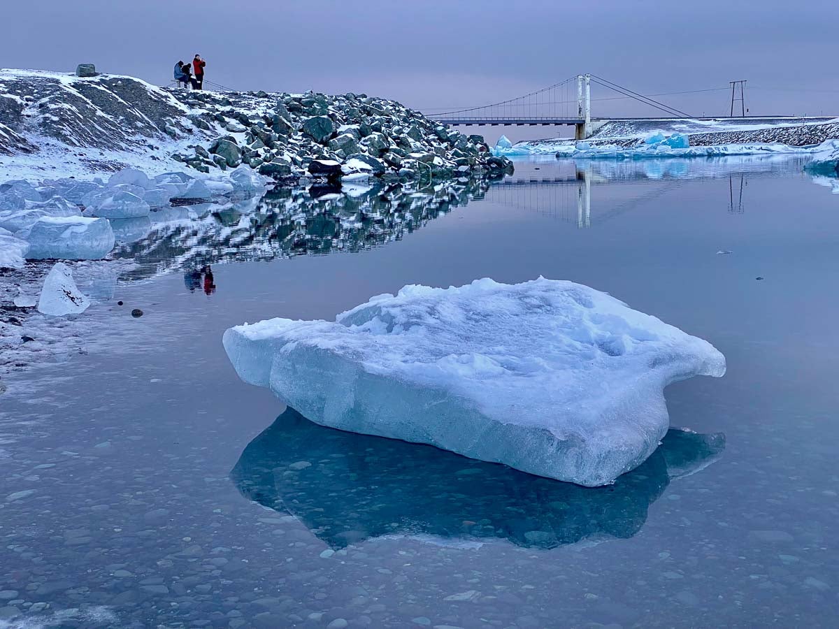 Small iceberg floats on still waters near the Jokulsarlon bridge.