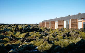 Silica Hotel at Blue Lagoon Iceland is surrounded by moss-covered lava fields.