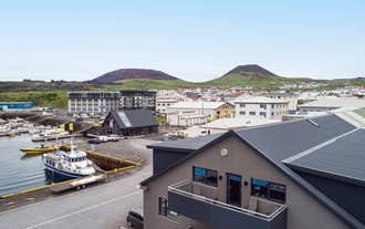 The Pier Apartments overlook Heimaey's harbor.