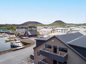 The Pier Apartments overlook Heimaey's harbor.