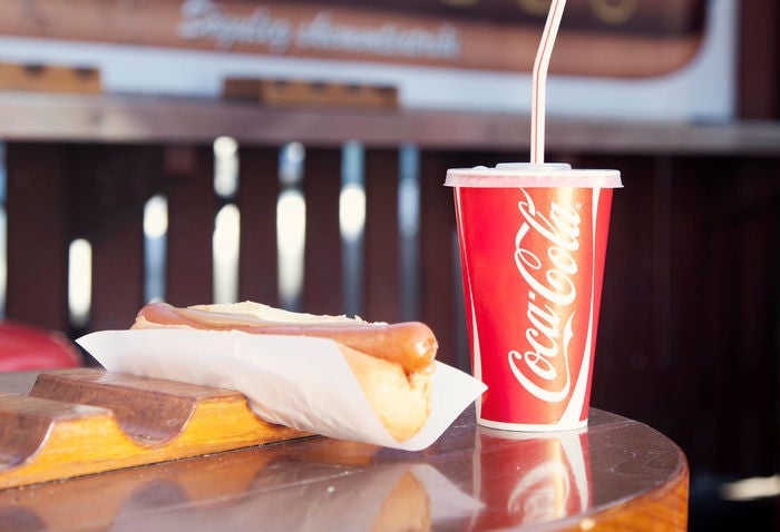 The Icelandic hot dog is served in a fluffy bun, topped with ketchup, remoulade, onion and mustard.