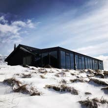 Hofsstadir Country Hotel surrounded by snow.