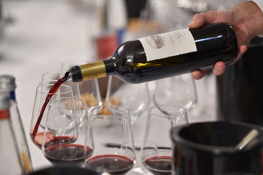 Bartender pouring wine at a Reykjavik bar Bartender pouring wine at a Reykjavik bar