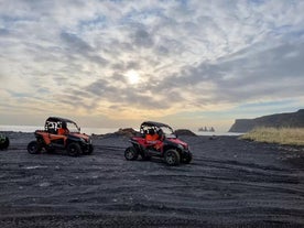 Two buggies on a black beach in Vik.