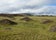 Grassy volcanic mounds of Vatnsdalsholar Hills under a cloudy sky in North Iceland..jpg