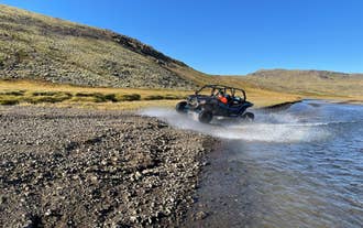 Buggy crossing rocky terrain beside a river on Iceland’s Golden Circle route.