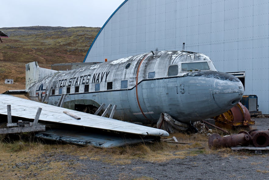 Retired U.S. Navy aircraft displayed outdoors at Hnjotur Museum in the Westfjords of Iceland.