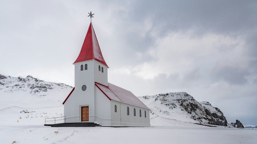 The iconic Vik i Myrdal Church in Iceland during winter. The iconic Vik i Myrdal Church in Iceland during winter.