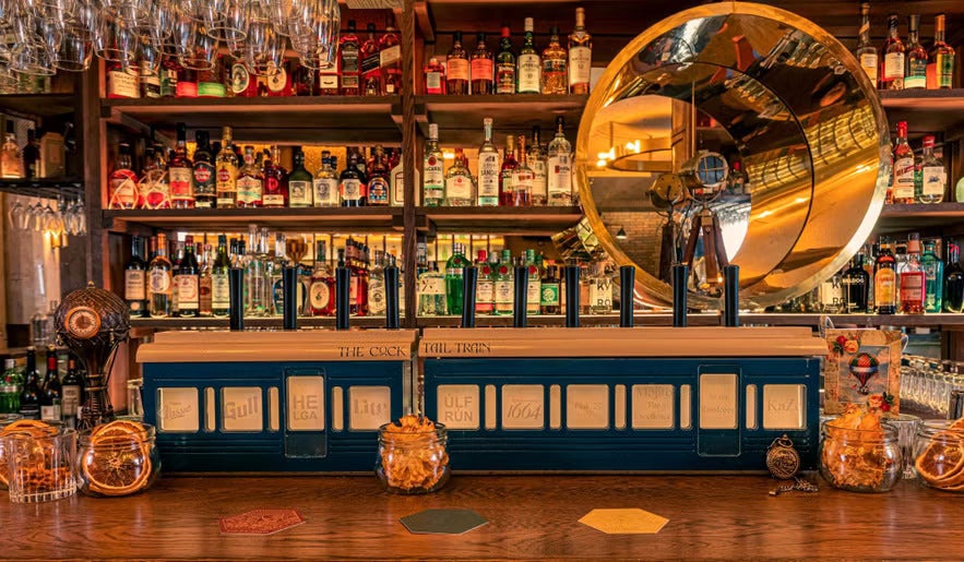The warm and inviting bar area of Kokteilbarinn in Reykjavik, Iceland.