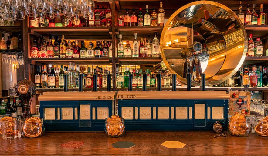 The warm and inviting bar area of Kokteilbarinn in Reykjavik, Iceland.