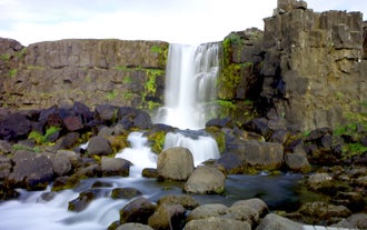 A waterfall in Thingvellir National Park, the biggest attraction on the Golden Circle sightseeing route in Iceland.