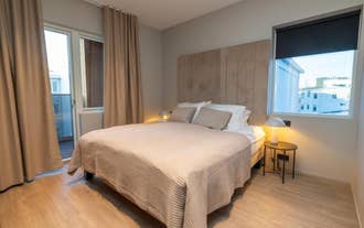 Bedroom with queen-sized bed at Luxury Apartment in Central Akureyri.