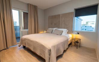Bedroom with queen-sized bed at Luxury Apartment in Central Akureyri.
