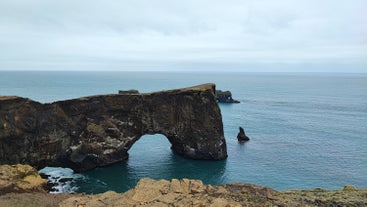 The Dyrholaey stone arch is large enough for small ships to pass through.