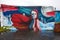 “Melisandre” mural by Natalia Moguel depicting a red-haired woman under a moonlit sky..jpg