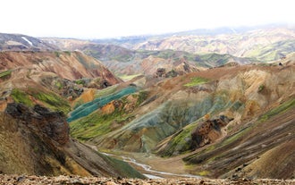 Panoramic view of Landmannalaugar’s colorful rhyolite hills in Iceland’s dramatic highlands.