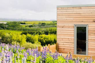 The exterior view of Blueberry Hills Villa amid lush natural surroundings.