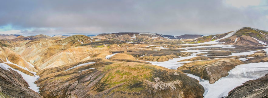 Panoramic view of snow-topped Hrafntinnusker Mountain Peak.